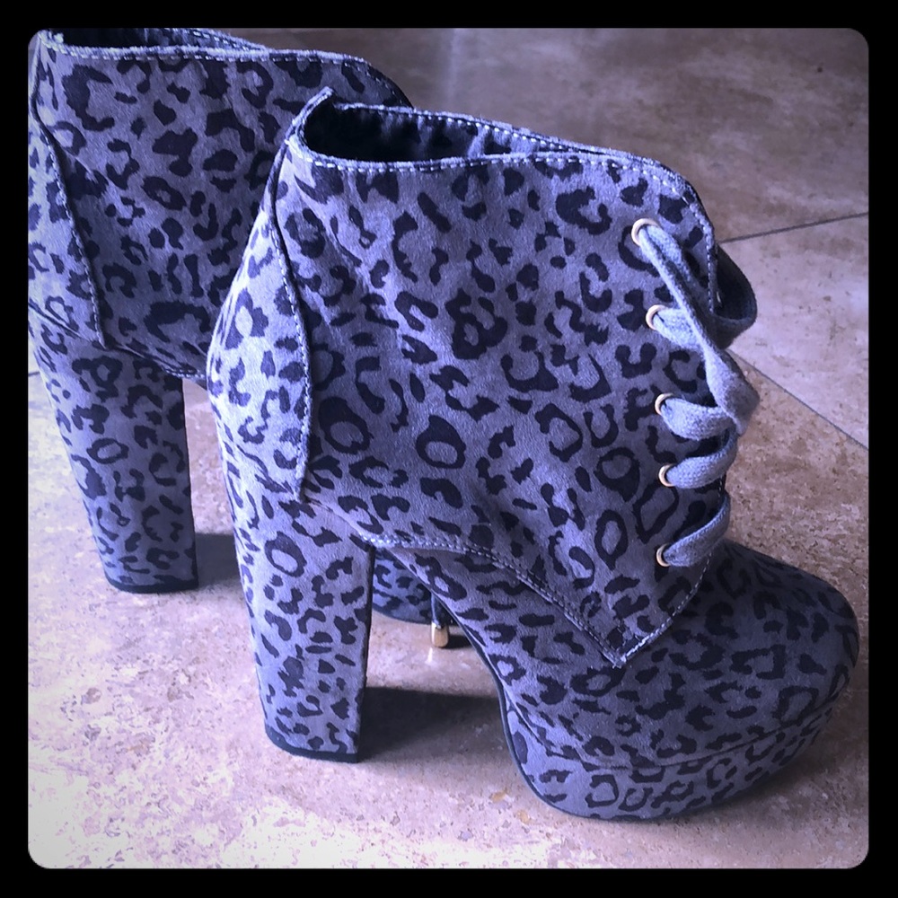 Grey and black animal print platform booties.